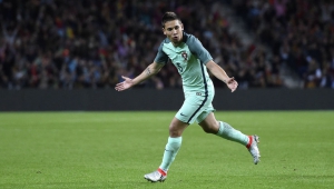 CORRECTION - Portugal's defender Raphael Guerreiro celebrates after scoring a goal during the friendly football match Portugal vs Norway at Dragao stadium in Porto on May 29, 2016, in preparation for the upcoming EURO 2016 tournament. / AFP / FRANCISCO LEONG / The erroneous mention[s] appearing in the metadata of this photo by FRANCISCO LEONG has been modified in AFP systems in the following manner: [on May 29, 2016] instead of [on May 28, 2016]. Please immediately remove the erroneous mention[s] from all your online services and delete it (them) from your servers. If you have been authorized by AFP to distribute it (them) to third parties, please ensure that the same actions are carried out by them. Failure to promptly comply with these instructions will entail liability on your part for any continued or post notification usage. Therefore we thank you very much for all your attention and prompt action. We are sorry for the inconvenience this notification may cause and remain at your disposal for any further information you may require.        (Photo credit should read FRANCISCO LEONG/AFP/Getty Images)